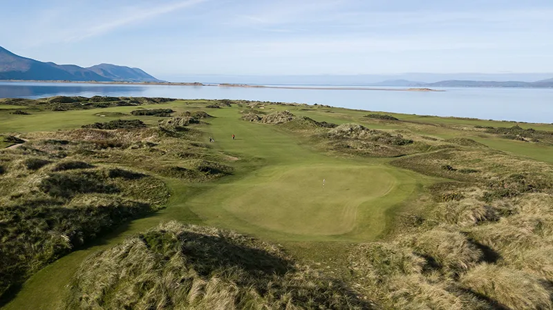 The fairway and green at Dooks Golf Links beside Dingle Bay.
