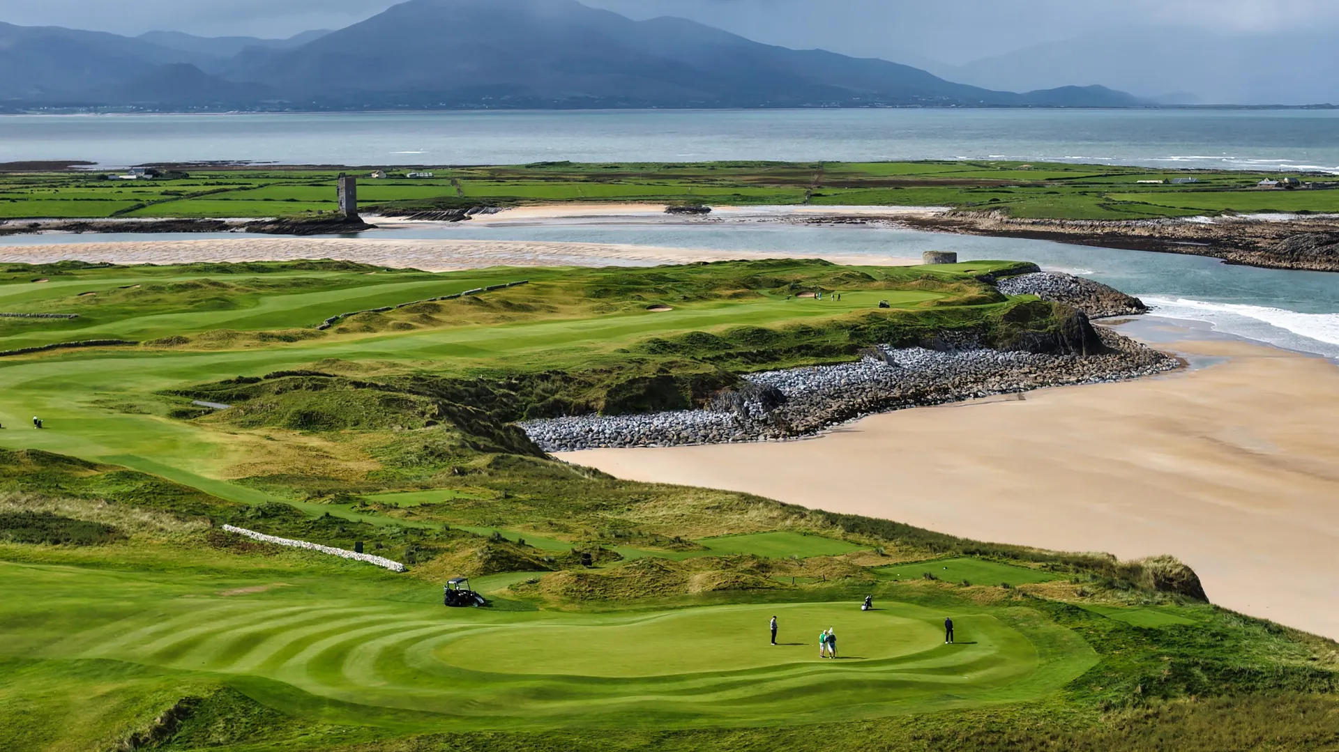 Tralee Golf Club’s coastal greens and fairways above the beach and Atlantic bay.